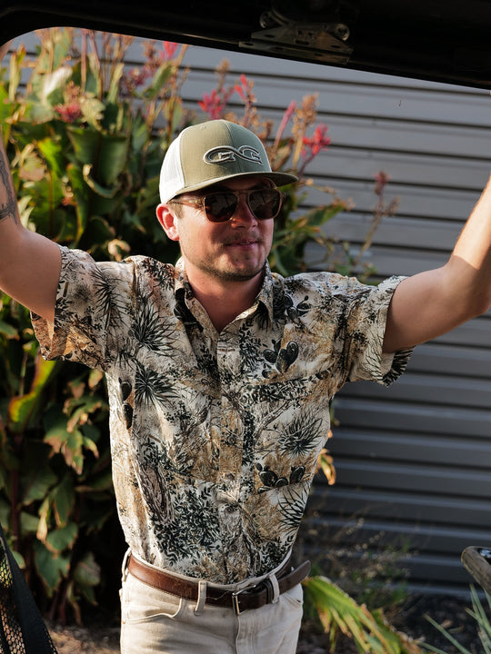 GameGuard Explorer Shirt-GameGuard - man relaxing outdoors getting ready to hunt leaning against a 4x4