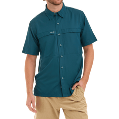 Man wearing a teal short-sleeve shirt with a brand logo on a white background