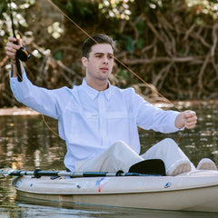 White Explorer Shirt | Long Sleeve-GameGuard- man fishing in a kayak wearing stylish white shirt protecting him from the sun