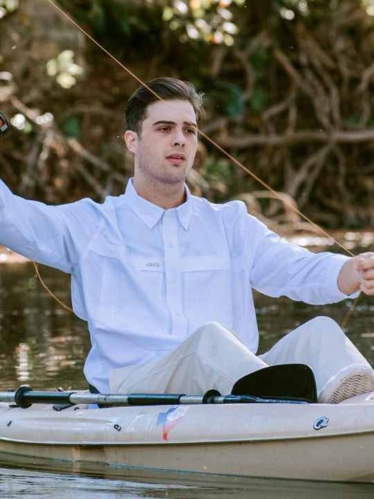 White Explorer Shirt | Long Sleeve-GameGuard- man fishing in a kayak wearing stylish white shirt protecting him from the sun
