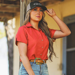 Lava Rock Ladies Original Shirt-GameGuard - Lady standing on the porch enjoying the outdoors while also wearing a Juniper Cap.