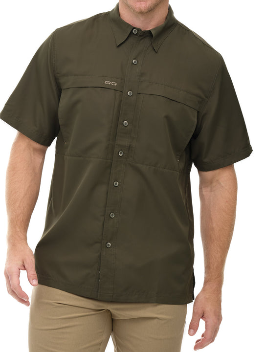 Man wearing Agave green GameGuard Original short sleeve shirt with mesh vents and chest pocketsbrugged, breathable, and great for hunting.