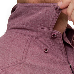 A man models a long sleeve pearl snap shirt in a rich maroon hue with soft texture. Includes two chest pockets with pearl snap closures and a discrete pen slot. Shirt features matching maroon snaps, subtle western yoke stitching, and the "GG" logo at the back. Shown styled with black pants in front, side, back, and close-up views of collar, cuff snaps, and pocket detail.