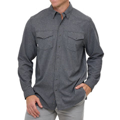 Man wearing Caviar GameGuard Pearl Snap Shirt with long sleeves, flap chest pockets, snap closures, and western yoke; classic rugged style for ranch or town.