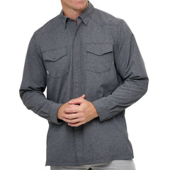 Man wearing Caviar GameGuard Pearl Snap Shirt with long sleeves, flap chest pockets, snap closures, and western yoke; classic rugged style for ranch or town.