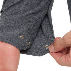 Man wearing Caviar GameGuard Pearl Snap Shirt with long sleeves, flap chest pockets, snap closures, and western yoke; classic rugged style for ranch or town.