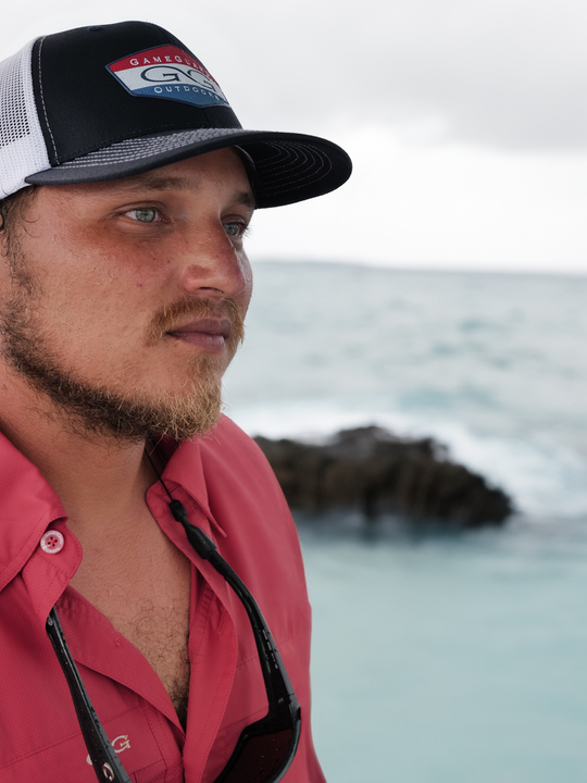 Lava Rock Explorer Shirt-GameGuard - man fishing on the water wearing red shirt that is lightweight and stylish